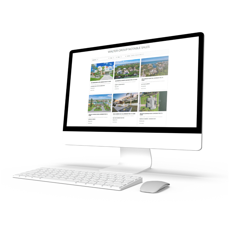 Computer displaying a real estate sales grid for Walter Group Real Estate, showing sortable property cards on a clean white interface.